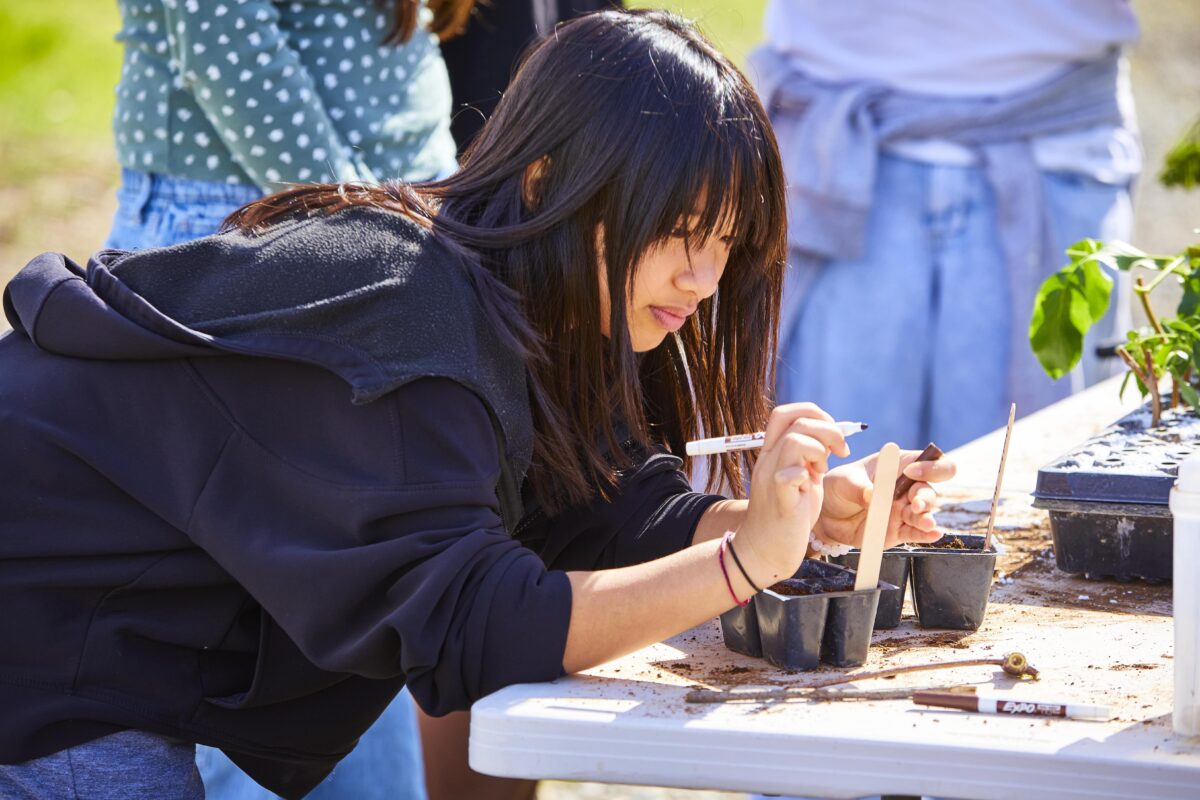 Students from Antioch Charter Academy conducting soil research at Family Harvest Farm