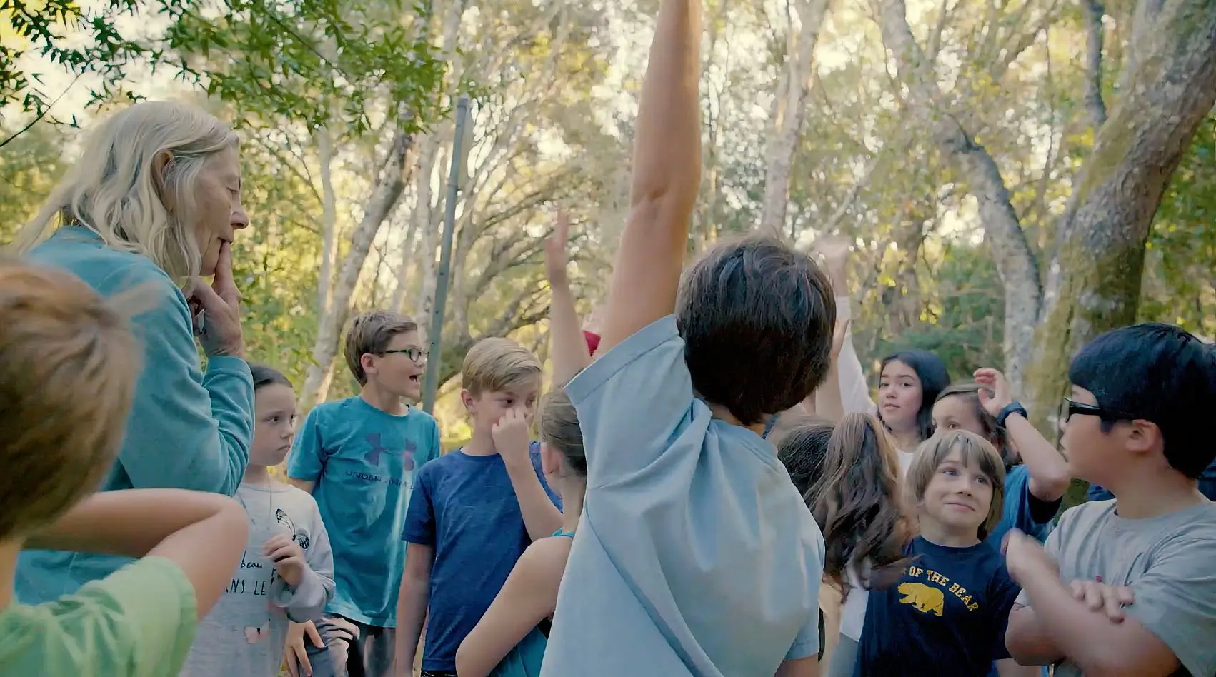 Toris Jaeger with a group of students outdoors at Wagner Ranch.